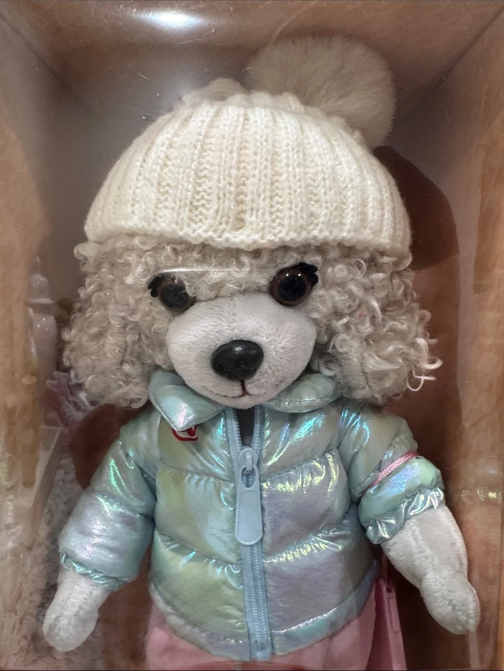 Willow Plush Dog in Iridescent Light Blue Jacket and Cream Knit Hat